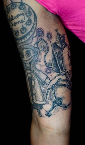 coraline-doll-cat-tattoo-arm-sleeve